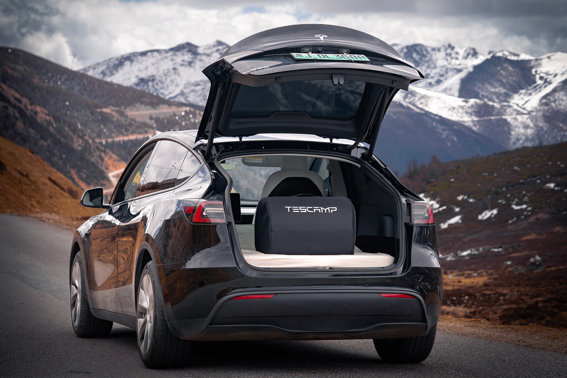 folded tesla model y mattress stored in sub-trunk
