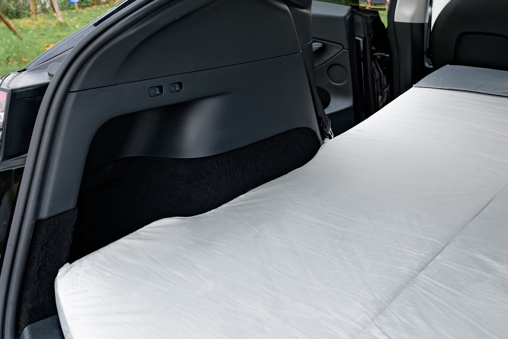 tesla model y mattress folded out in rear trunk area