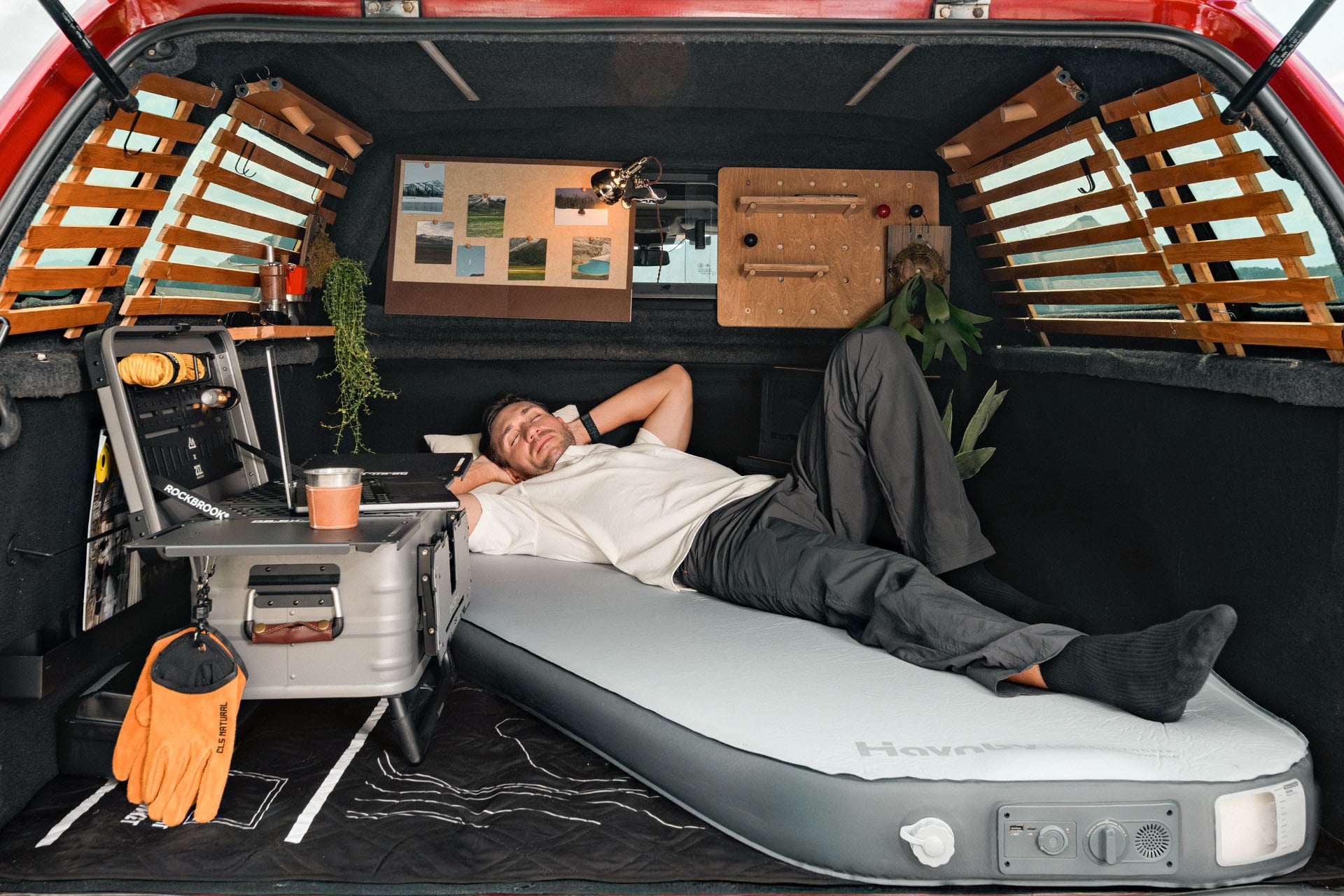 Man stretched out on Havnby truck mattress showing extra length.